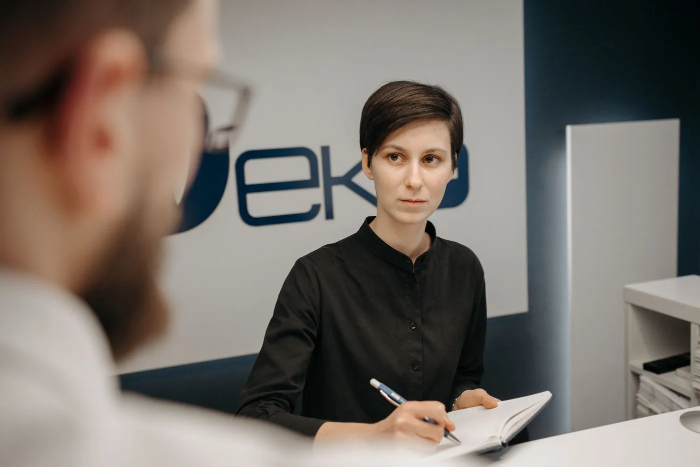 Healthcare front desk reviewing insurance eligibility information